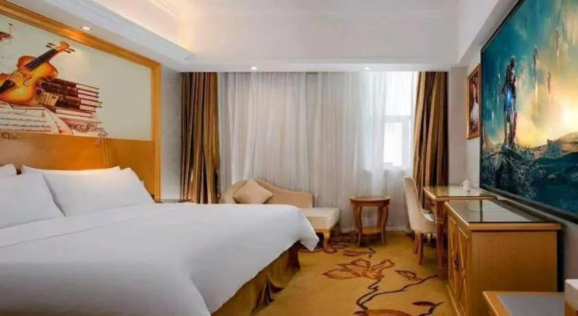 Bed in Vienna Hotel Shenzhen Longgang Baifucheng