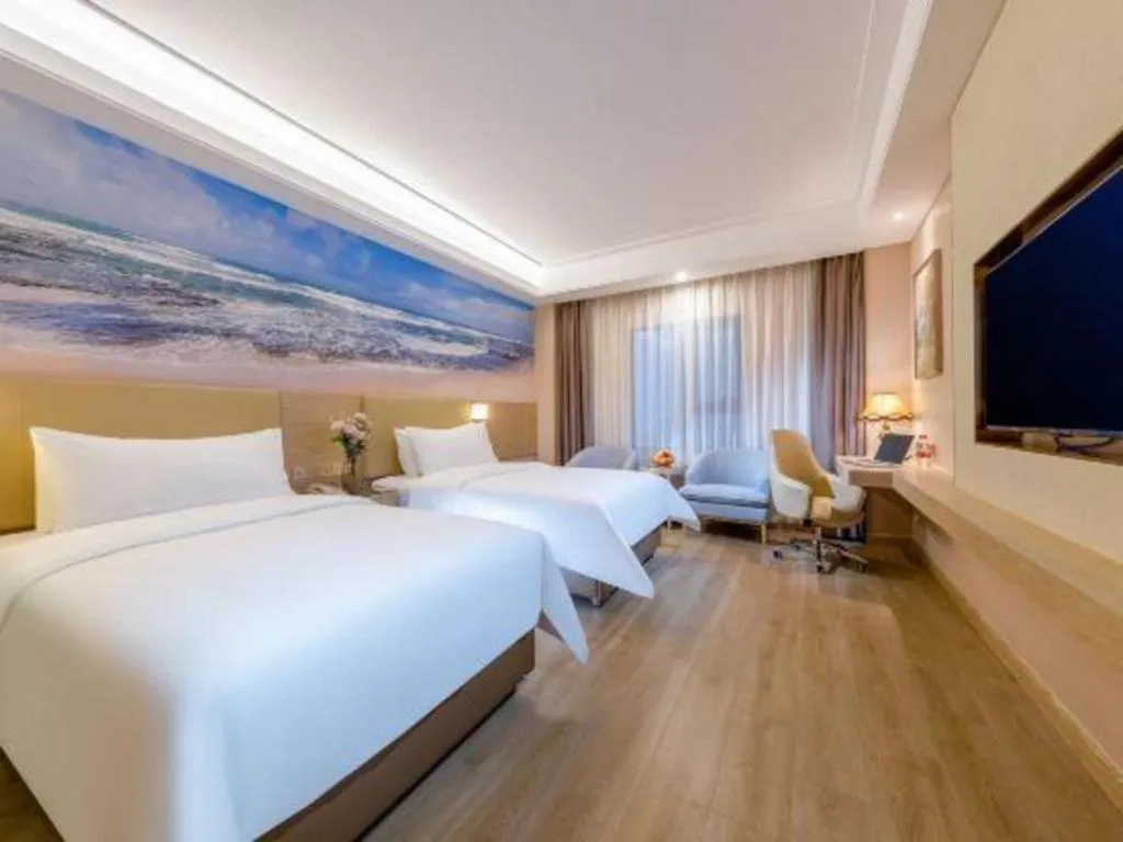 Bed in Vienna Hotel Shenzhen Longgang Baifucheng