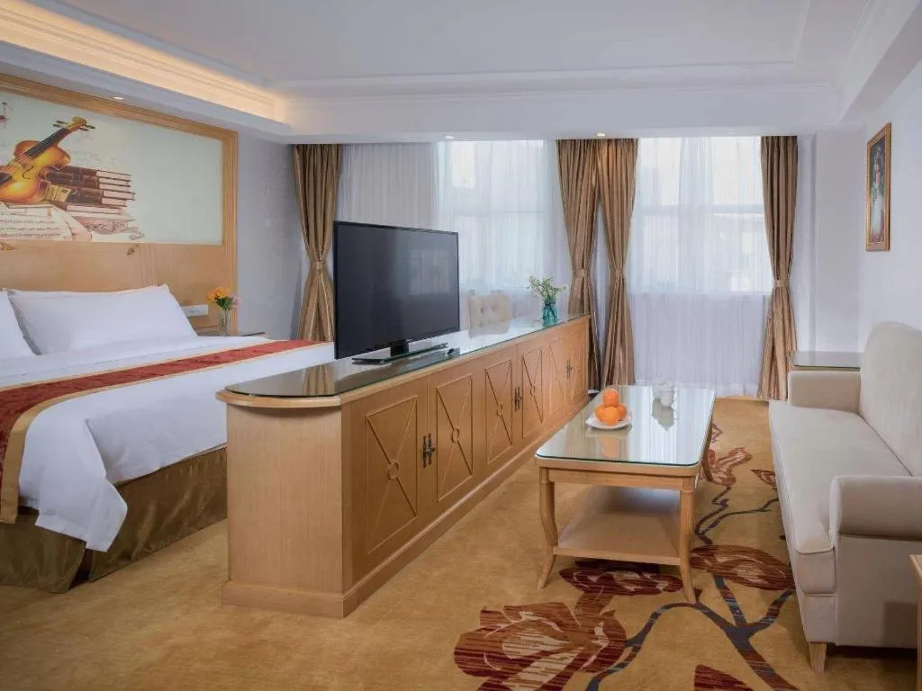 Bed in Vienna Hotel Shenzhen Longgang Baifucheng