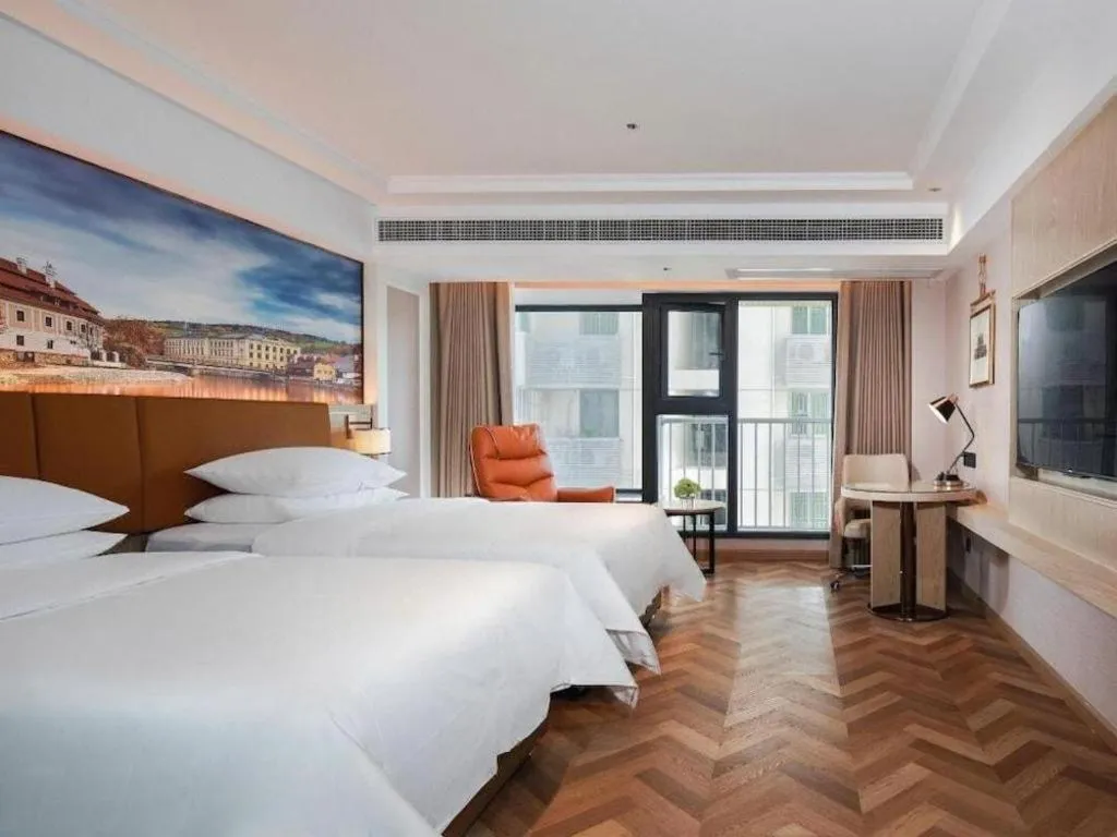 Bed in Vienna Hotel Shenzhen Longgang Baifucheng