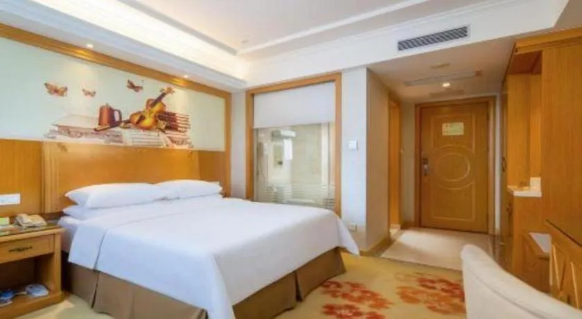 Bed in Vienna Hotel Shenzhen Longgang Baifucheng