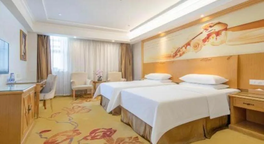 Bed in Vienna Hotel Shenzhen Longgang Baifucheng