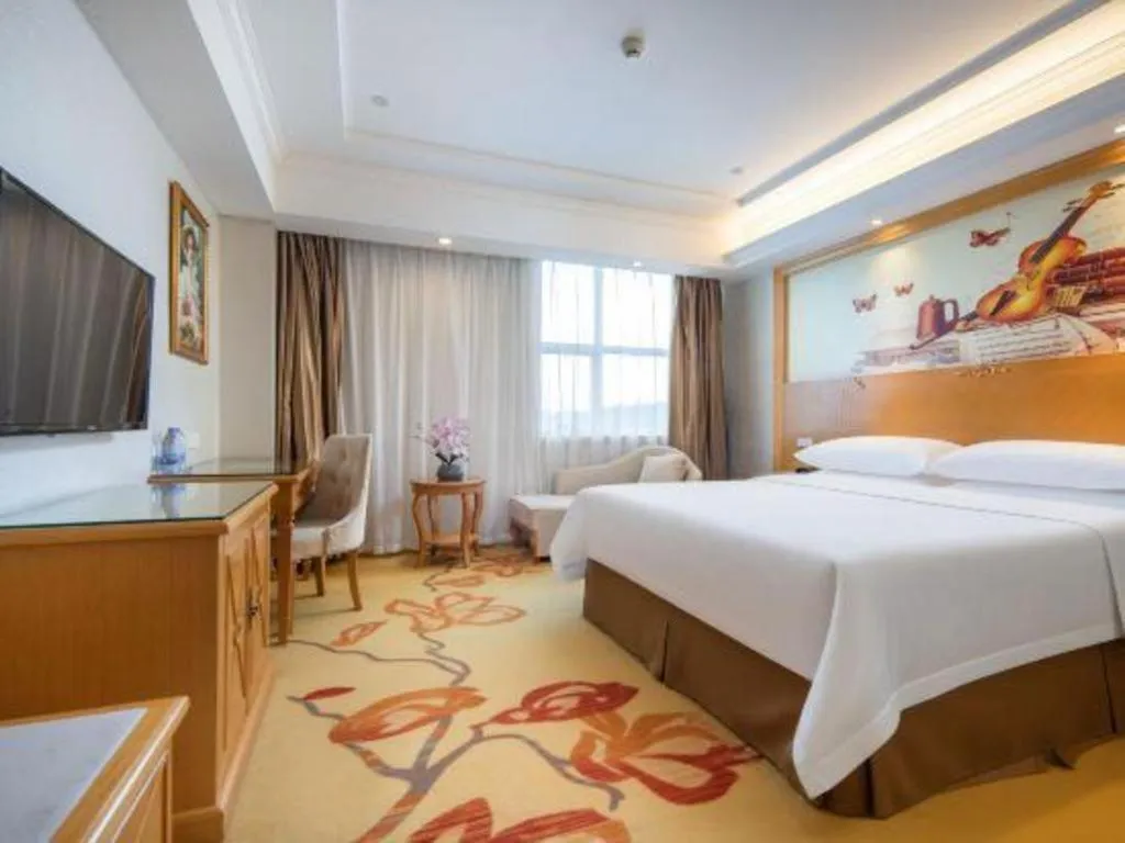 Bed in Vienna Hotel Shenzhen Longgang Baifucheng