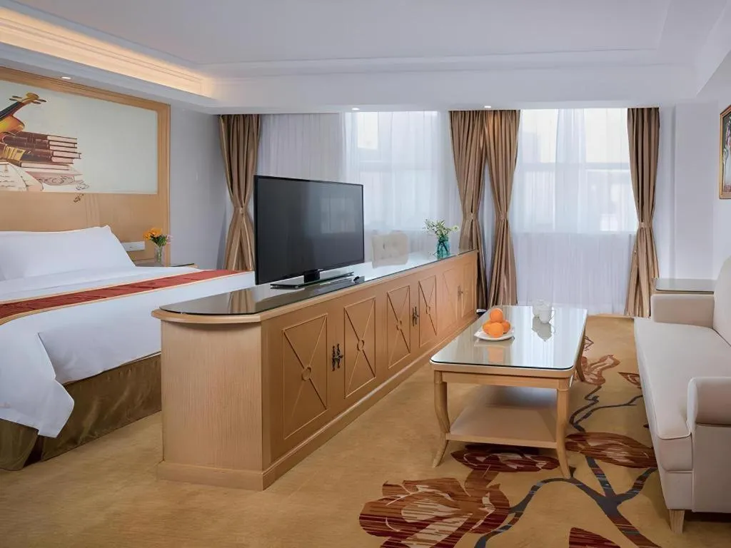 Bed in Vienna Hotel Shenzhen Longgang Baifucheng