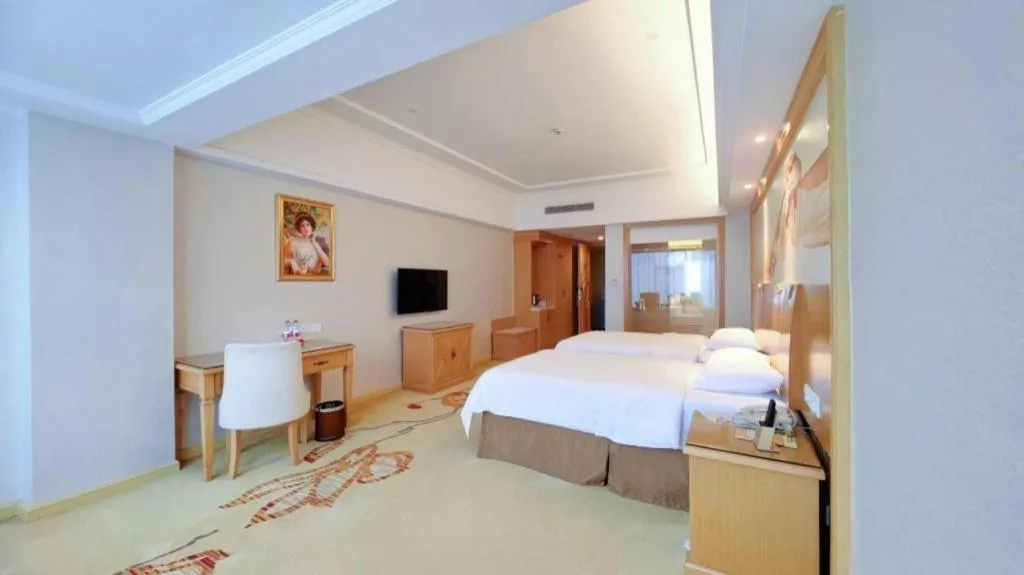 Bed in Vienna Hotel Shenzhen Longgang Baifucheng