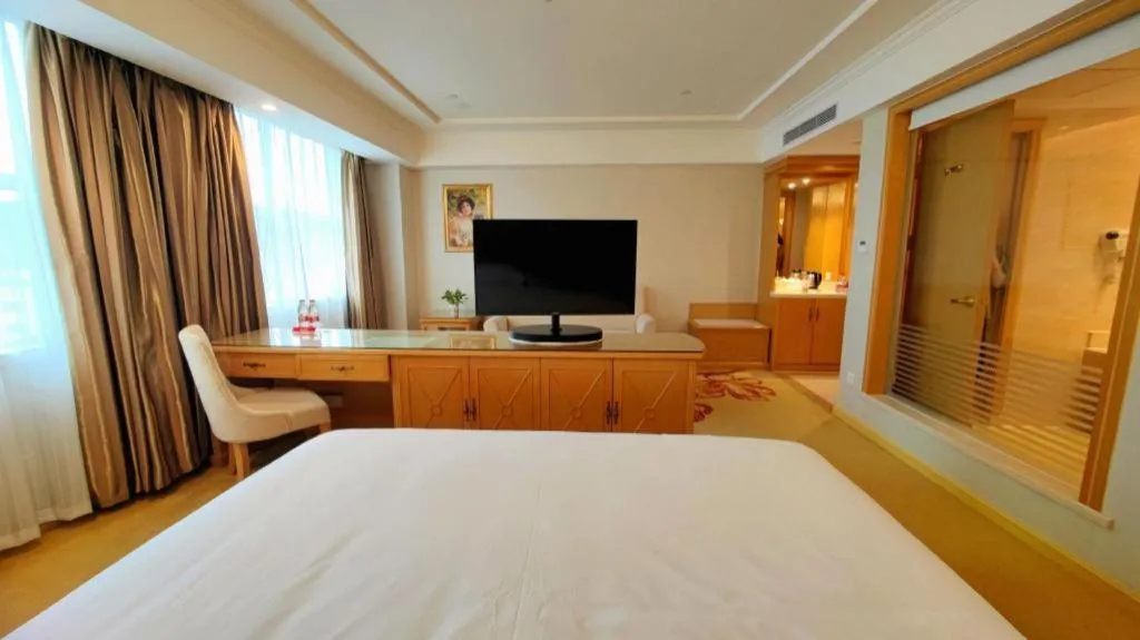 Bed in Vienna Hotel Shenzhen Longgang Baifucheng