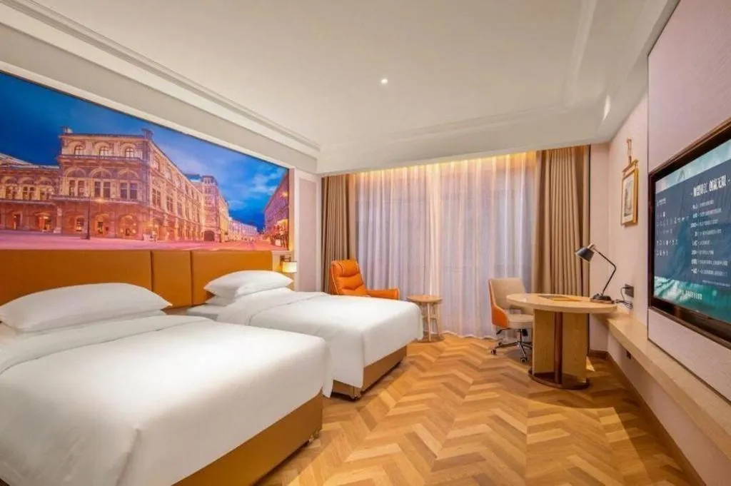 Bed in Vienna Hotel Shenzhen Longgang Baifucheng