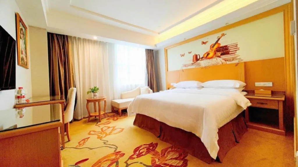 Bed in Vienna Hotel Shenzhen Longgang Baifucheng