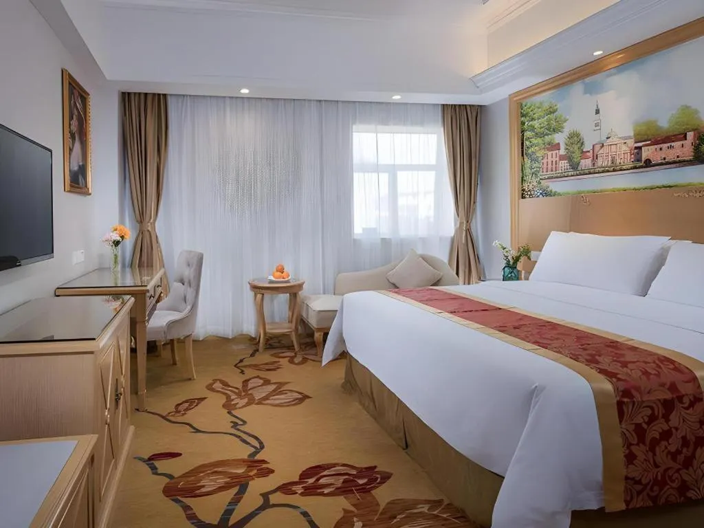 Bed in Vienna Hotel Shenzhen Longgang Baifucheng