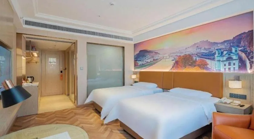 Bed in Vienna Hotel Shenzhen Longgang Baifucheng