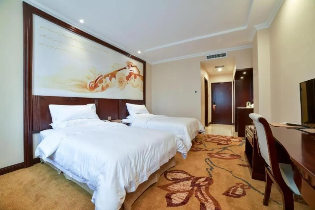 Bed in Vienna Classic Hotel Zhangzhou Longchi Center