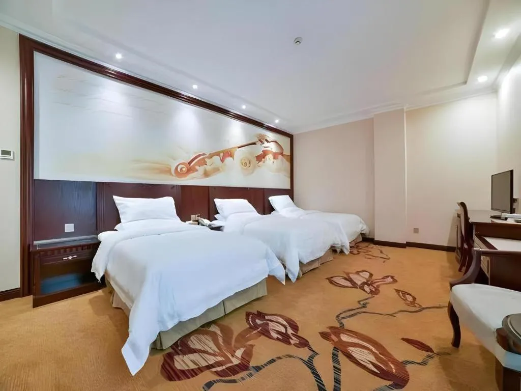 Bed in Vienna Classic Hotel Zhangzhou Longchi Center