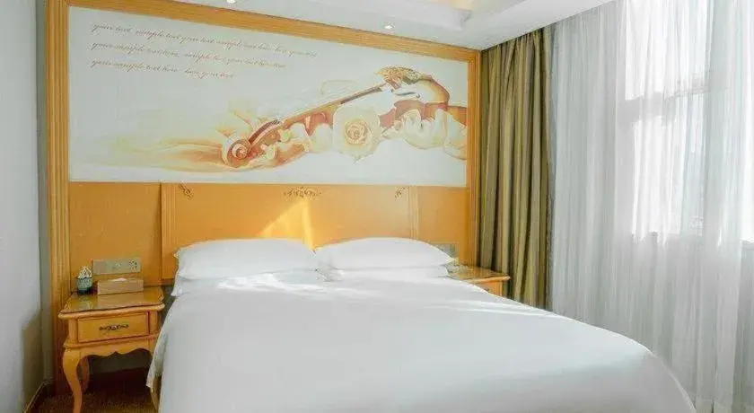 Bed in Vienna Hotel Guangdong Huizhou Lilin North Railway Station Bed in Vienna Hotel Guangdong Huizhou Lilin North Railway Station