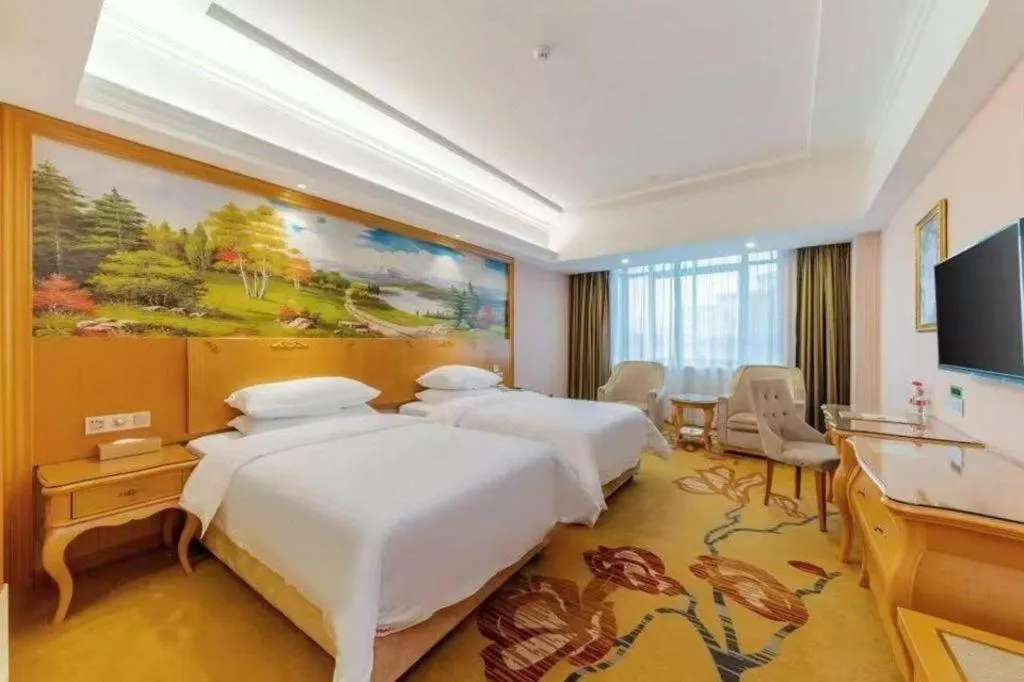 Bed in Vienna Hotel Guangdong Huizhou Lilin North Railway Station