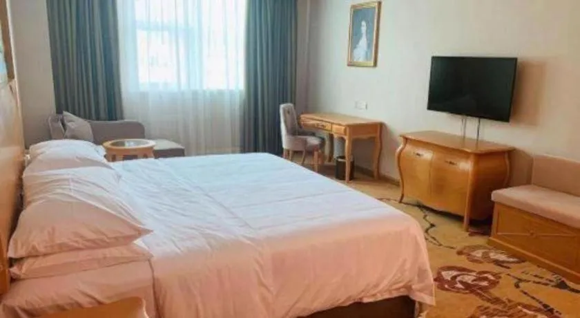 Bed in Vienna Hotel Guangdong Huizhou Lilin North Railway Station