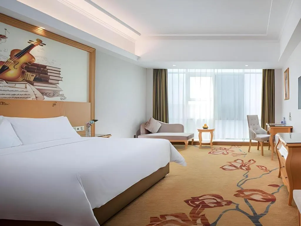 Bed in Vienna Hotel Guangdong Huizhou Lilin North Railway Station