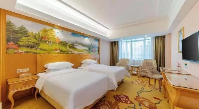 Bed in Vienna Hotel Guangdong Huizhou Lilin North Railway Station