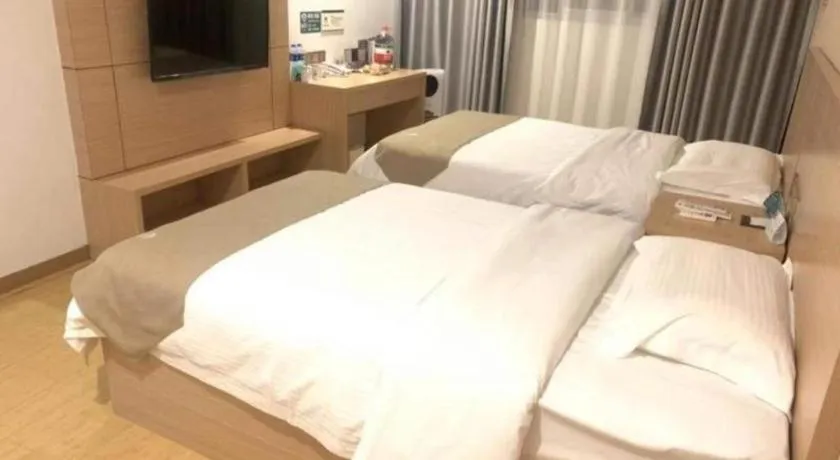 Bed in GreenTree Inn Yancheng Dongtai Fuan Town Express Hotel