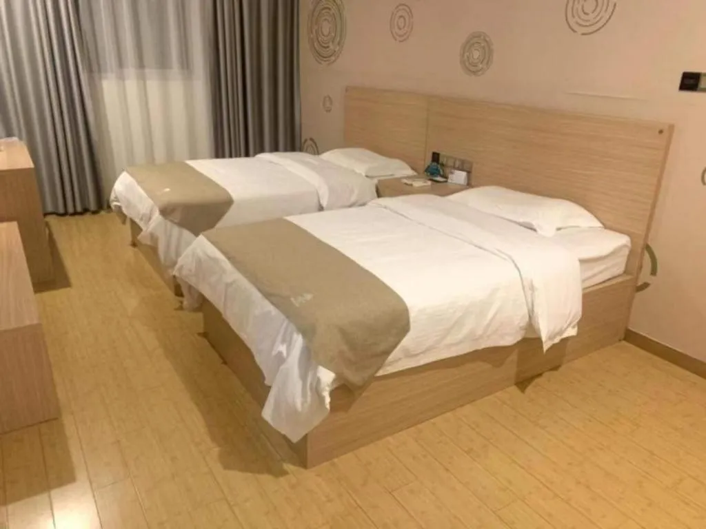Bed in GreenTree Inn Yancheng Dongtai Fuan Town Express Hotel