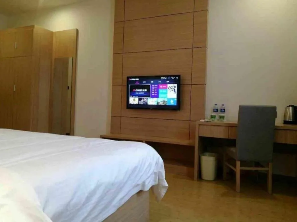 Bed in GreenTree Inn Yancheng Dongtai Fuan Town Express Hotel