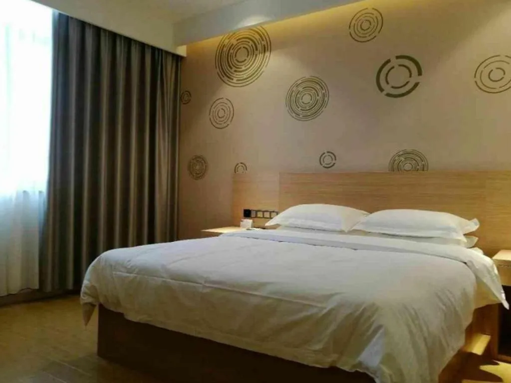 Bed in GreenTree Inn Yancheng Dongtai Fuan Town Express Hotel