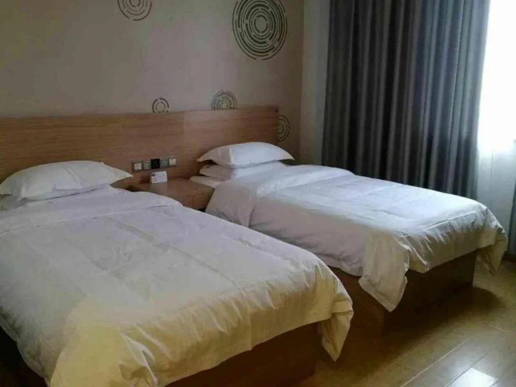 Bed in GreenTree Inn Yancheng Dongtai Fuan Town Express Hotel