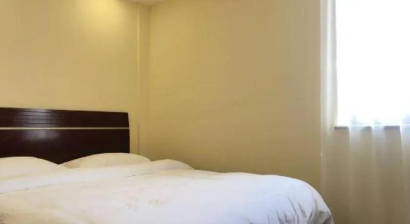 Bed in Shell Hotel Shanghai Baoshan Meilanhu Luosheng Road