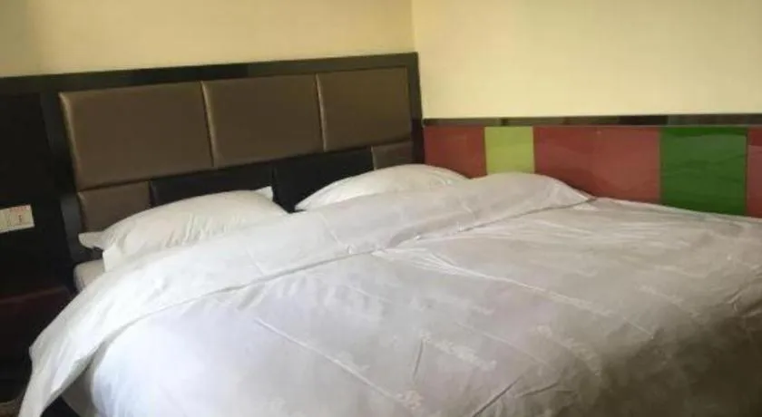 Bed in Shell Hotel Shanghai Baoshan Meilanhu Luosheng Road