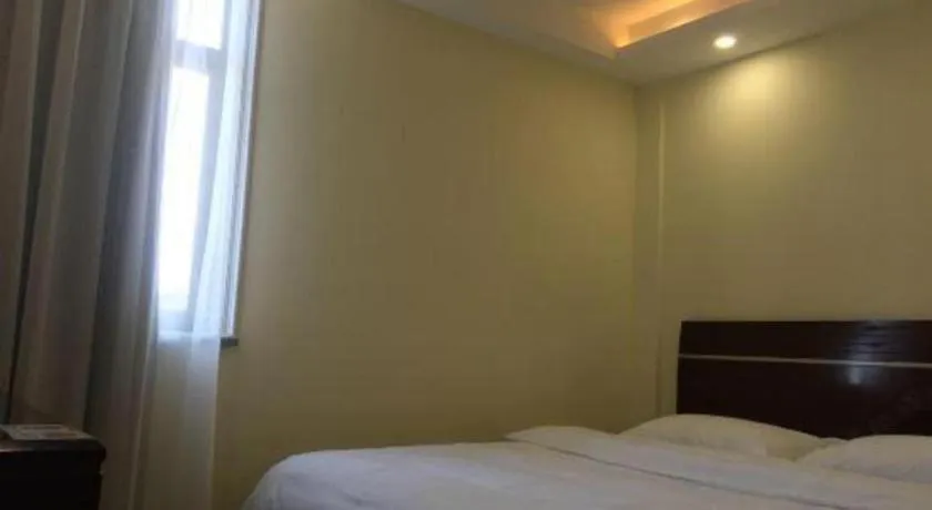 Bed in Shell Hotel Shanghai Baoshan Meilanhu Luosheng Road