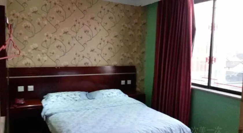 Bed in Shell Hotel Shanghai Baoshan Meilanhu Luosheng Road