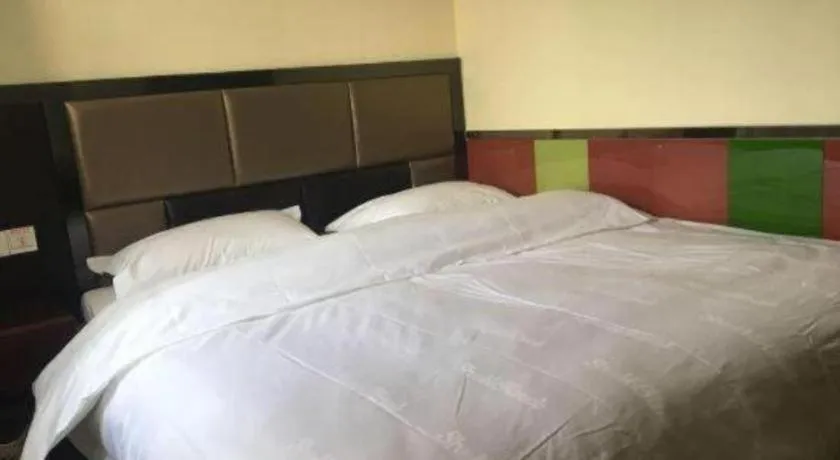 Bed in Shell Hotel Shanghai Baoshan Meilanhu Luosheng Road