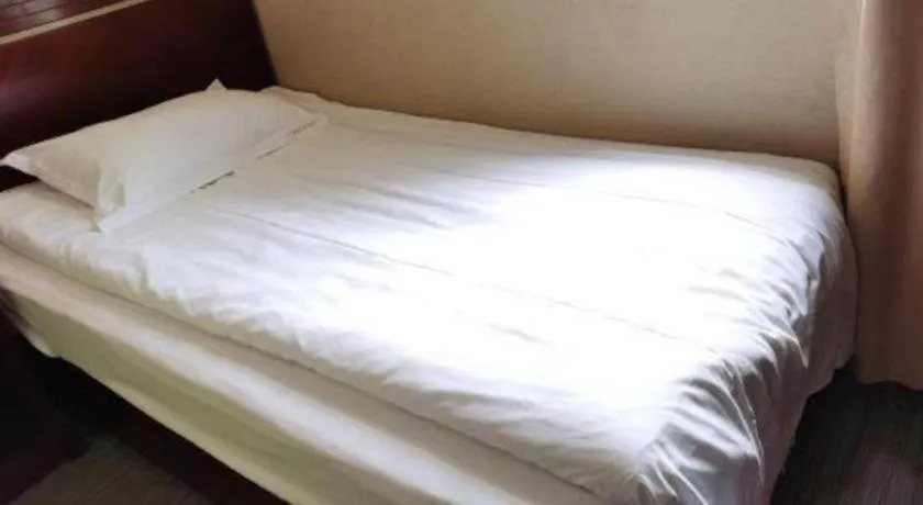 Bed in Shell Hotel Shanghai Baoshan Meilanhu Luosheng Road