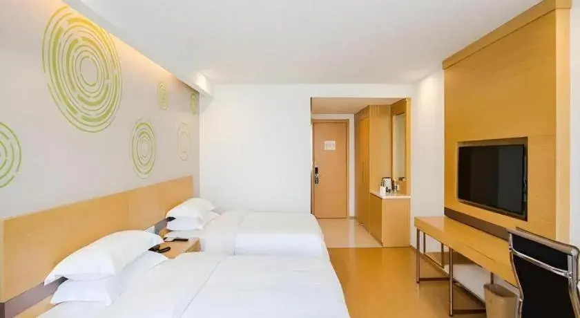 Bed in GreenTree Inn Jiaxing Qixing Town Goverment Bed in GreenTree Inn Jiaxing Qixing Town Goverment