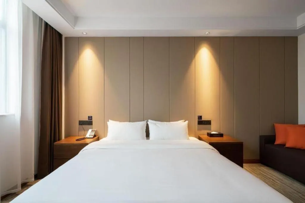 Bed in GME Taizhou Jingjiang City Bus Station Hotel