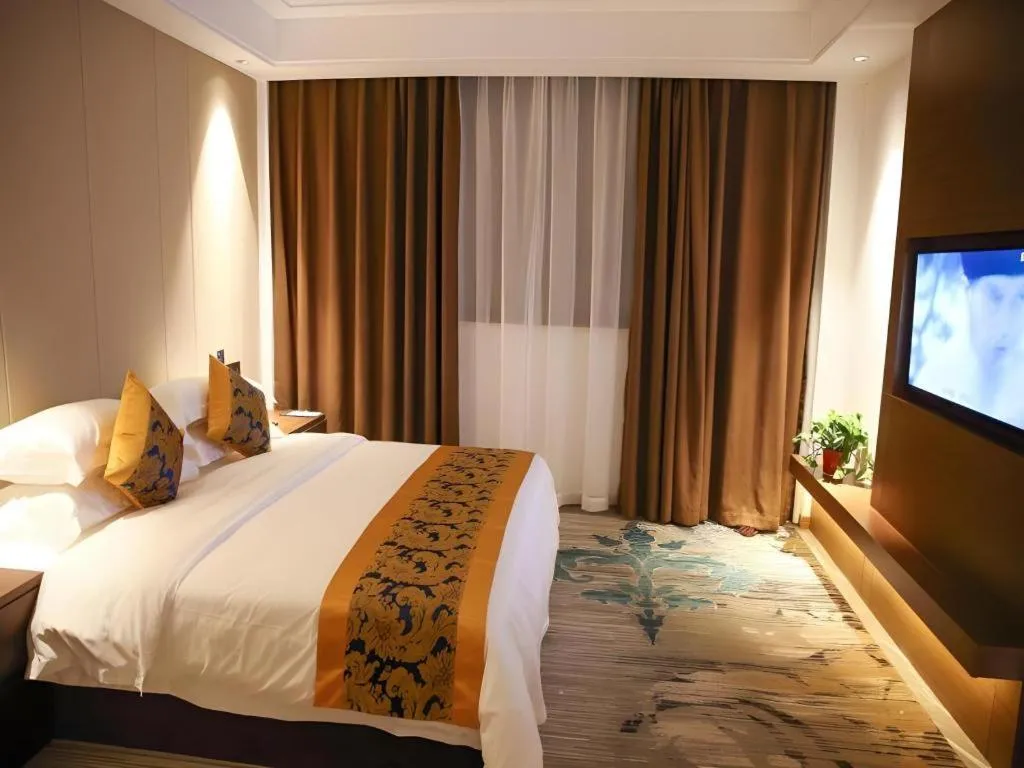 Bed in GME Taizhou Jingjiang City Bus Station Hotel