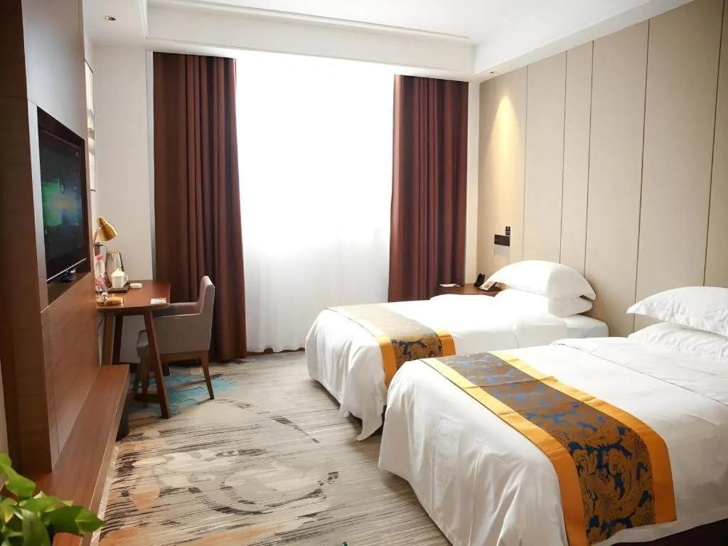 Bed in GME Taizhou Jingjiang City Bus Station Hotel