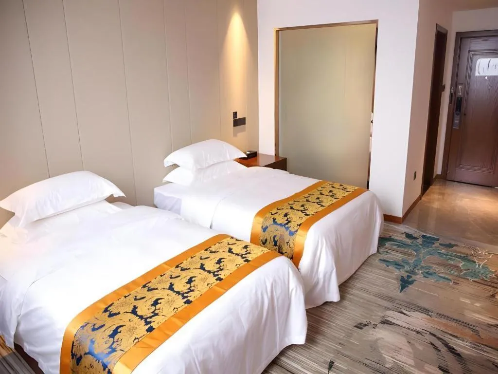 Bed in GME Taizhou Jingjiang City Bus Station Hotel