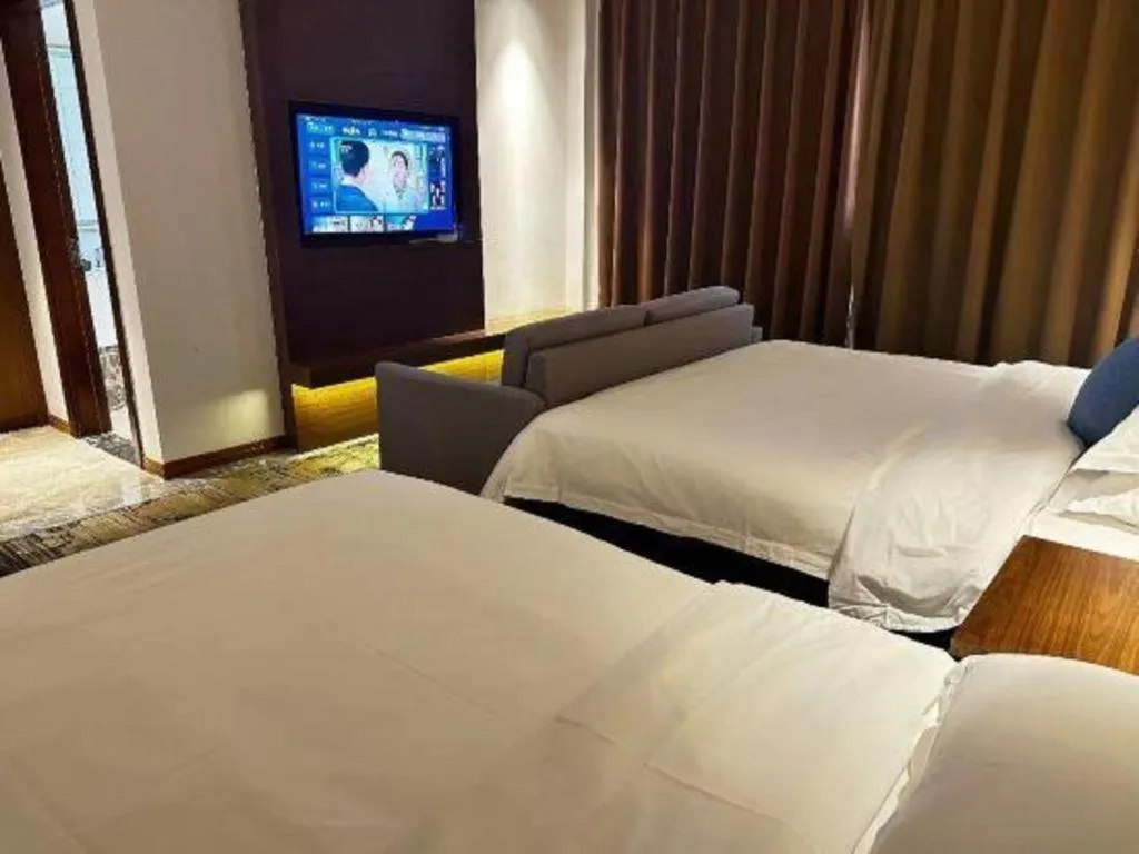 Bed in GME Taizhou Jingjiang City Bus Station Hotel
