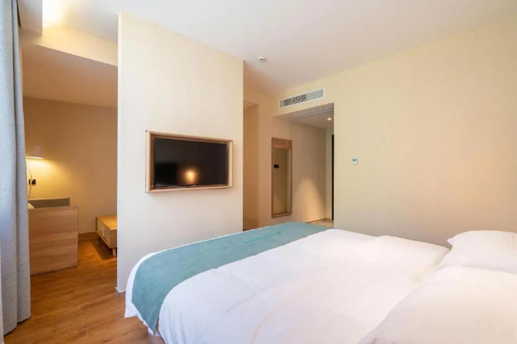 Bed in GreenTree Inn Wuxi Quanshan Center