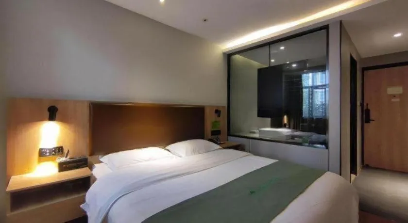 Bed in GreenTree Inn Wuxi Quanshan Center