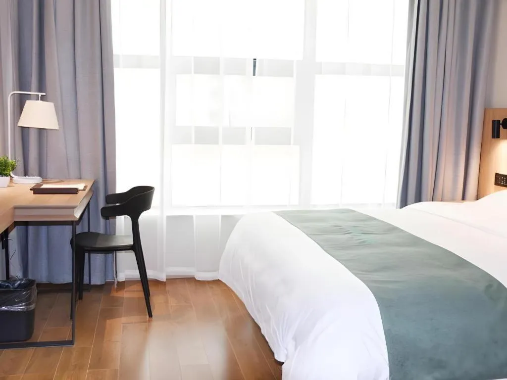 Bed in GreenTree Inn Wuxi Quanshan Center