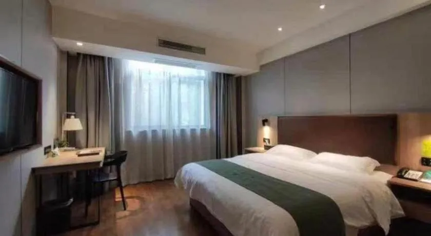Bed in GreenTree Inn Wuxi Quanshan Center