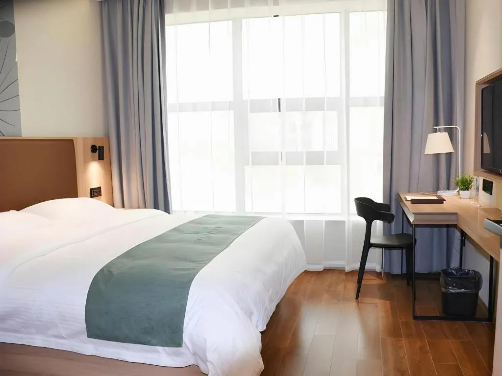 Bed in GreenTree Inn Wuxi Quanshan Center