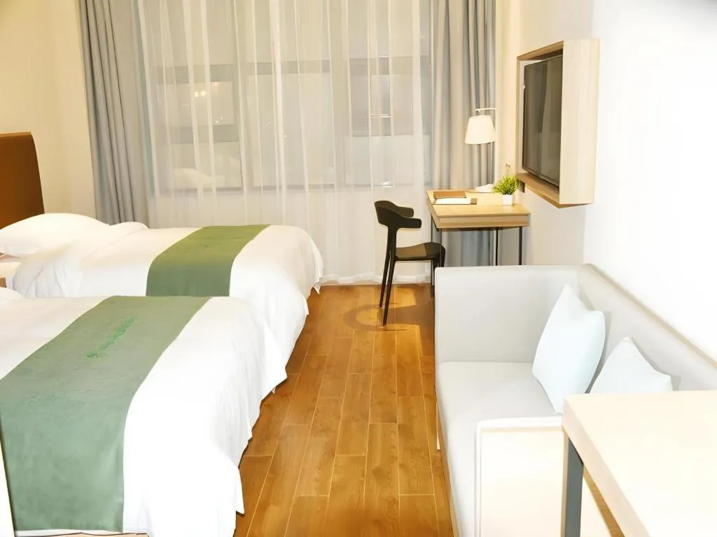 Bed in GreenTree Inn Wuxi Quanshan Center