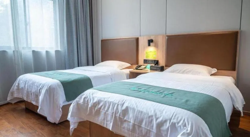Bed in GreenTree Inn Wuxi Quanshan Center