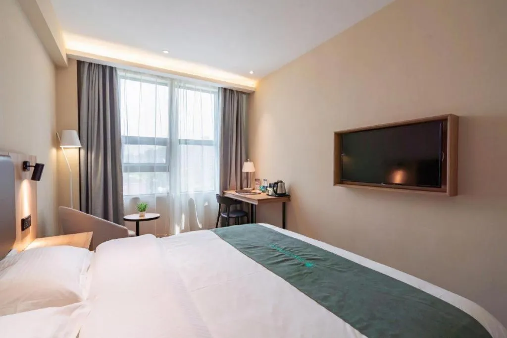 Bed in GreenTree Inn Wuxi Quanshan Center