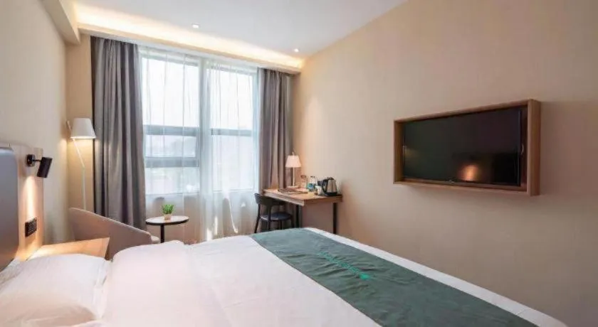 Bed in GreenTree Inn Wuxi Quanshan Center