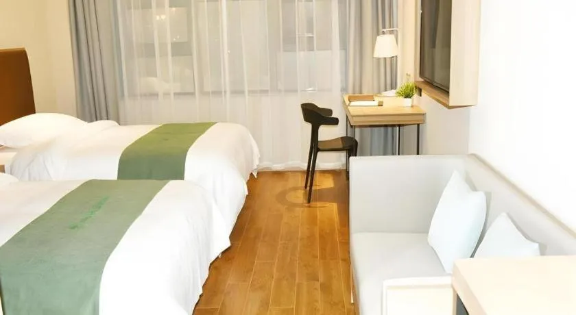 Bed in GreenTree Inn Wuxi Quanshan Center