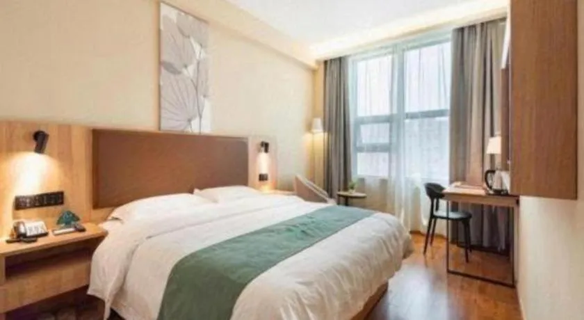 Bed in GreenTree Inn Wuxi Quanshan Center