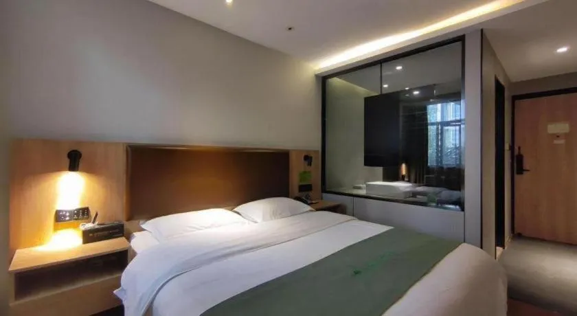 Bed in GreenTree Inn Wuxi Quanshan Center